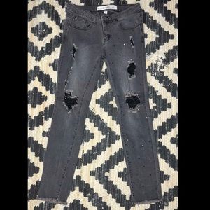 Studded black ripped jeans